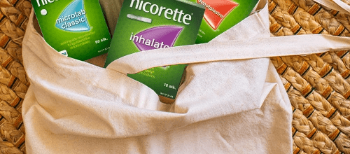 Bag containing Nicorette Microtabs, Nicorette Inhalator and Nicorette Invisipatch products